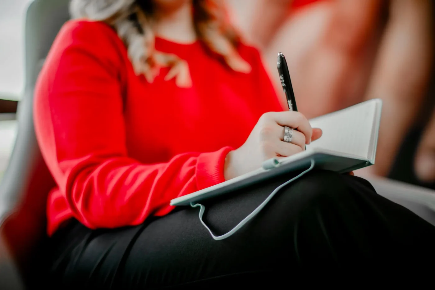 Close-up of note-taking during a clinical rehabilitation counseling session